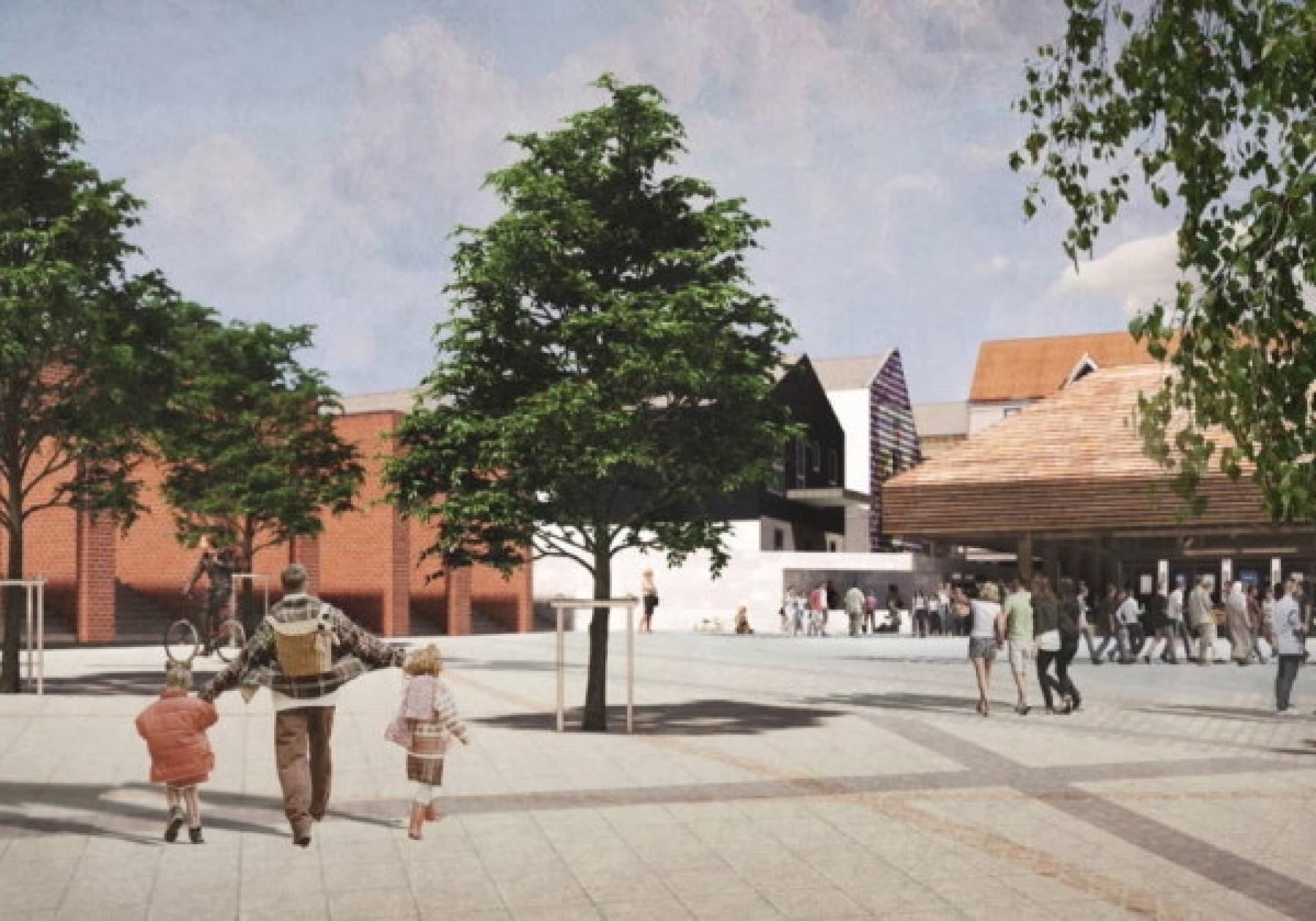 En stor dels plads leder hen til pavillonen som rummer spisested og en scene.