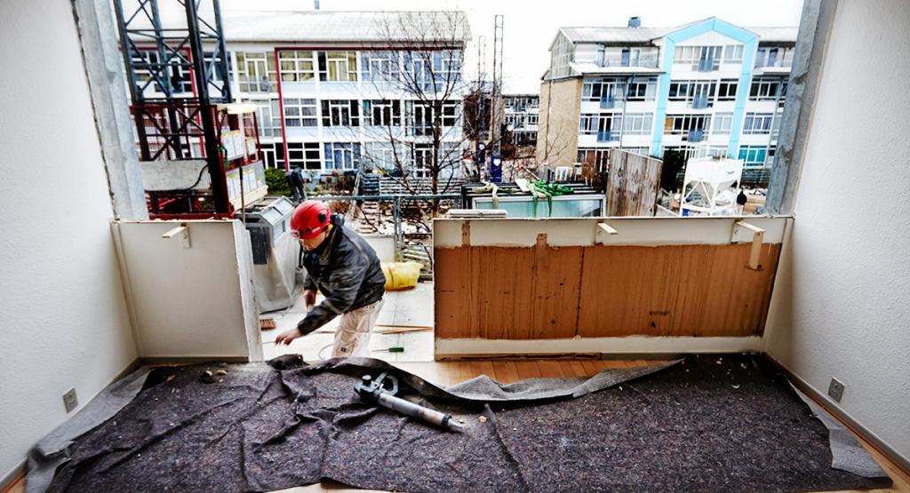 Renoveringen omfatter tage, facader og gavle i 57 boligblokke.